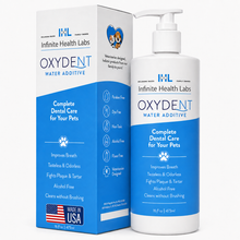 A white and blue bottle of Infinite Health Labs Oxydent Pet Dental Care | Dog & Cat Water Additive for Bad Breath, Tartar & Gum Health stands next to its box, both featuring pet icons and a Made in USA label. The packaging highlights its alcohol-free, tasteless formula and emphasizes its effectiveness as a dental care solution for pets.
